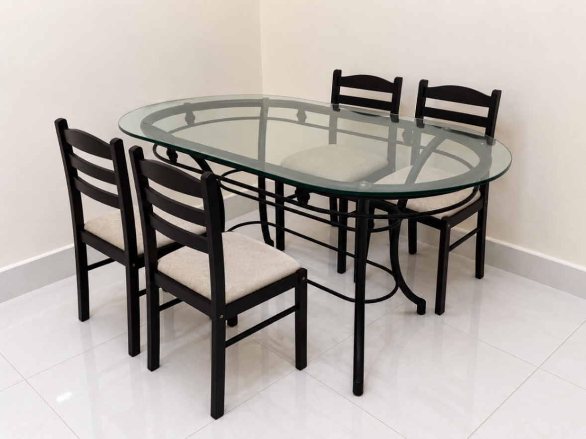 6 seater Oval Glass dinning table with 4 matching chanirs - Image 3